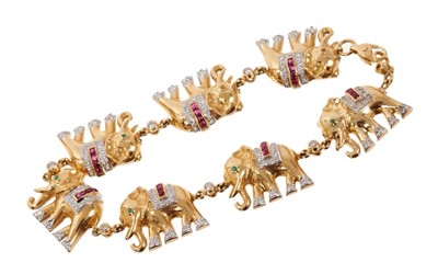 Lot 454 - 18ct gold bracelet composed of a line of seven elephants, sent with diamonds, rubies and emeralds