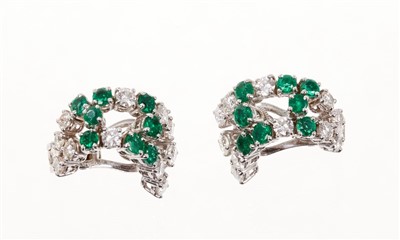 Lot 449 - Pair of Boucheron diamond and emerald ear clips, each signed and numbered 94103, hallmarked London 1982