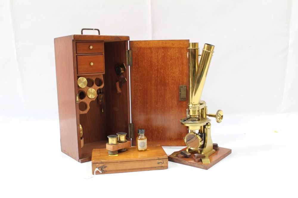 Lot 3525 - Good 19th century lacquered brass binocular microscope, probably by Ross of London, on tripod base and wooden stand, 33cm high, apparently unsigned but one lens case engraved Ross London, various a...