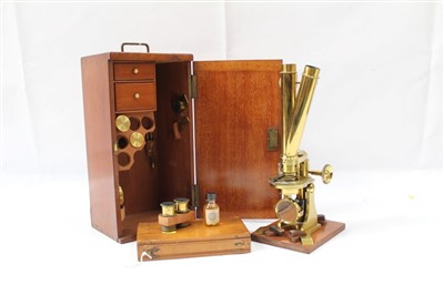 Lot 3525 - Good 19th century lacquered brass binocular microscope, probably by Ross of London, on tripod base and wooden stand, 33cm high, apparently unsigned but one lens case engraved Ross London, various a...