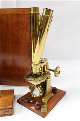 Lot 3525 - Good 19th century lacquered brass binocular microscope, probably by Ross of London, on tripod base and wooden stand, 33cm high, apparently unsigned but one lens case engraved Ross London, various a...