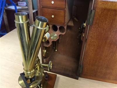 Lot 3525 - Good 19th century lacquered brass binocular microscope, probably by Ross of London, on tripod base and wooden stand, 33cm high, apparently unsigned but one lens case engraved Ross London, various a...