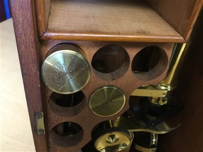 Lot 3525 - Good 19th century lacquered brass binocular microscope, probably by Ross of London, on tripod base and wooden stand, 33cm high, apparently unsigned but one lens case engraved Ross London, various a...