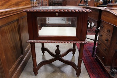 Lot 1385 - 1920s mahogany display cabinet, of square form with bevelled glass top and sides and fold down front on column supports and X-stretcher, 58cm wide