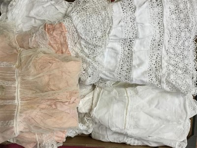 Lot 3079 - Quantity of Victorian and later babies clothing including white cotton and lace christening gowns, Liberty bodices, dresses, similar ladies long night dresses, two lace baby bonnets and two framed...