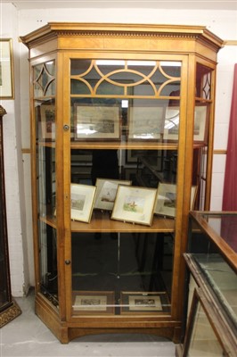 Lot 1388 - Large Edwardian satinwood display cabinet, of canted outline, with dentil cornice and enclosed by glazed door on shaped plinth 180cm wide x 90cm deep x 220cm high