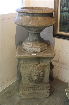 Lot 1394 - Antique carved stone urn, on squat form on stepped octagonal foot, raised on square plinth with projecting lion masks, total height 101cm