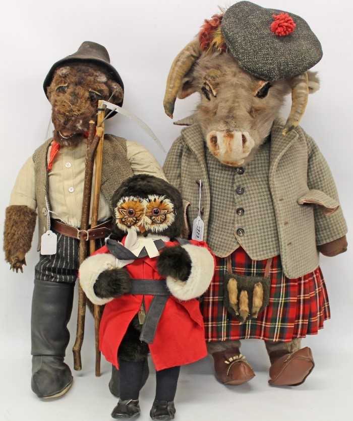 Lot 2773 - Large character soft toy goat dressed as a Scottish laird, another soft toy dressed as a farmer holding a scythe and an owl judge (3)