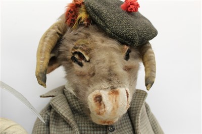 Lot 2773 - Large character soft toy goat dressed as a Scottish laird, another soft toy dressed as a farmer holding a scythe and an owl judge (3)