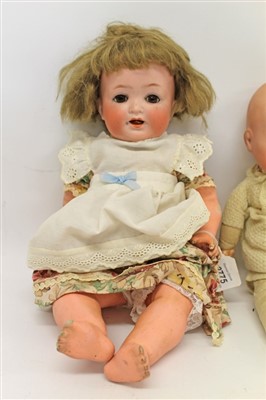 Lot 2775 - Doll- bisque head Heubach Koppelsdorf 342.3 with brown sleeping eyes, painted features, composite body and limbs, together with an Armand Marseille dream baby (2)