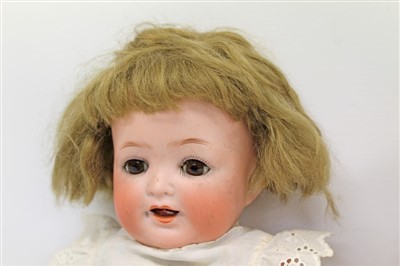 Lot 2775 - Doll- bisque head Heubach Koppelsdorf 342.3 with brown sleeping eyes, painted features, composite body and limbs, together with an Armand Marseille dream baby (2)