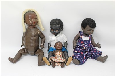 Lot 2776 - Two hard plastic black dolls by Pedigree, German composite black doll and one other smaller black doll (4)