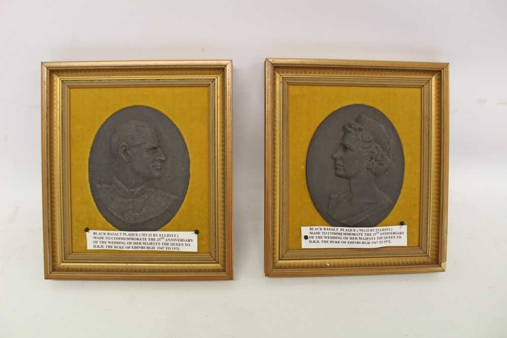 Lot 2079 - Pair of Black Basalt profile relief plaque by Elliot of Queen Elizabeth II and The Duke of Edinburgh, to commemorate their silver wedding, in gilt frames (2)
