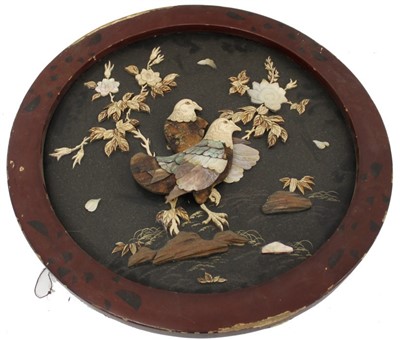 Lot 3573 - Early 20th century Japanese shibyama panel , depicting hawks in a landscape, relief ornament in bone ivory wood and mother-of pearl, circular red lacquer frame, total size 45cm diameter