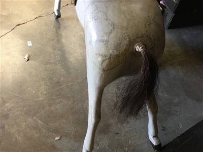 Lot 3581 - Antique painted wood rocking horse figure, dapple grey finish, now lacking base, 92cm long