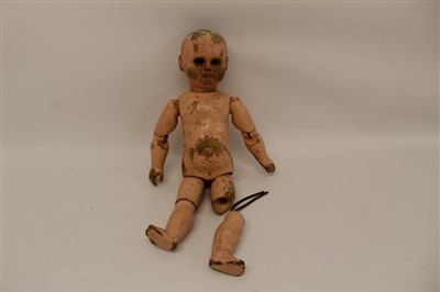 Lot 2791 - 19th century carved wooden painted doll, eyes missing, with ball jointed limbs.