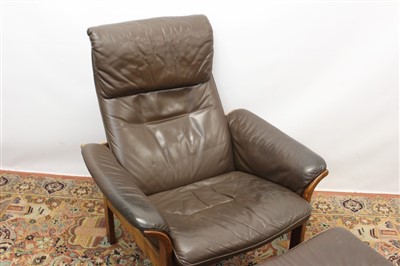 Lot 1310 - Vintage Swedish leather recliner chair and footstool