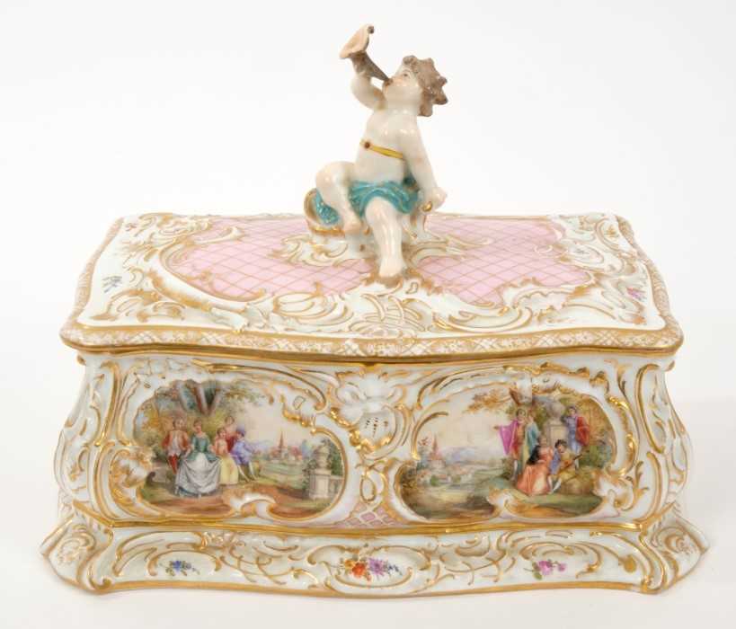 Lot 51 - Continental porcelain box and cover with putto surmount