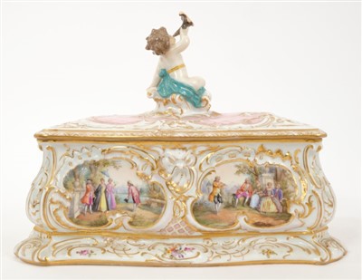 Lot 51 - Continental porcelain box and cover with putto surmount
