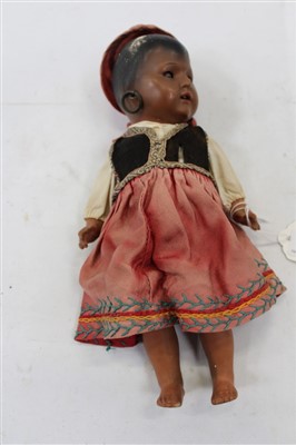 Lot 2793 - Doll Gypsy bisque head Heubach Koppelsdorf 452.14/0. Moulder head, painted features, brown sleeping eyes open mouth top two teeth showing. Hoop ear rings. Gypsy clothing.