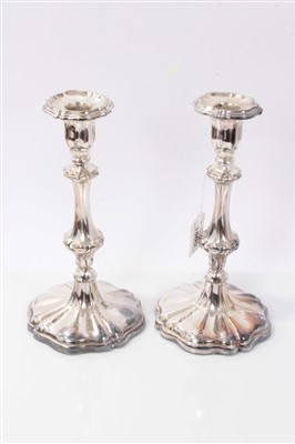 Lot 3800 - Pair of mid 19th century silver plated candlesticks on shaped fluted bases