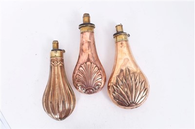 Lot 904 - Three copper and brass power flasks, including one by Hawksley