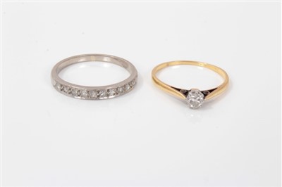 Lot 3260 - Single stone diamond ring, together with a diamond half eternity ring (2)