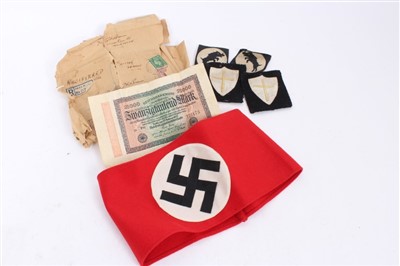 Lot 555 - Nazi party arm band with RZM paper label to interior, numbered - 344686 together with some other cloth badges