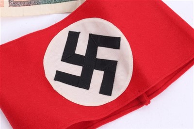 Lot 555 - Nazi party arm band with RZM paper label to interior, numbered - 344686 together with some other cloth badges