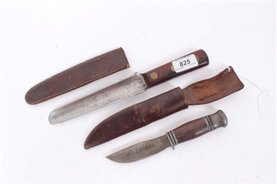 Lot 825 - Unusual early 20th century knife by Needham Veall and Tyzack with hollow ground blade and rounded point ,rosewood grips with brass studs and leather sheath and a hunting knife (2)