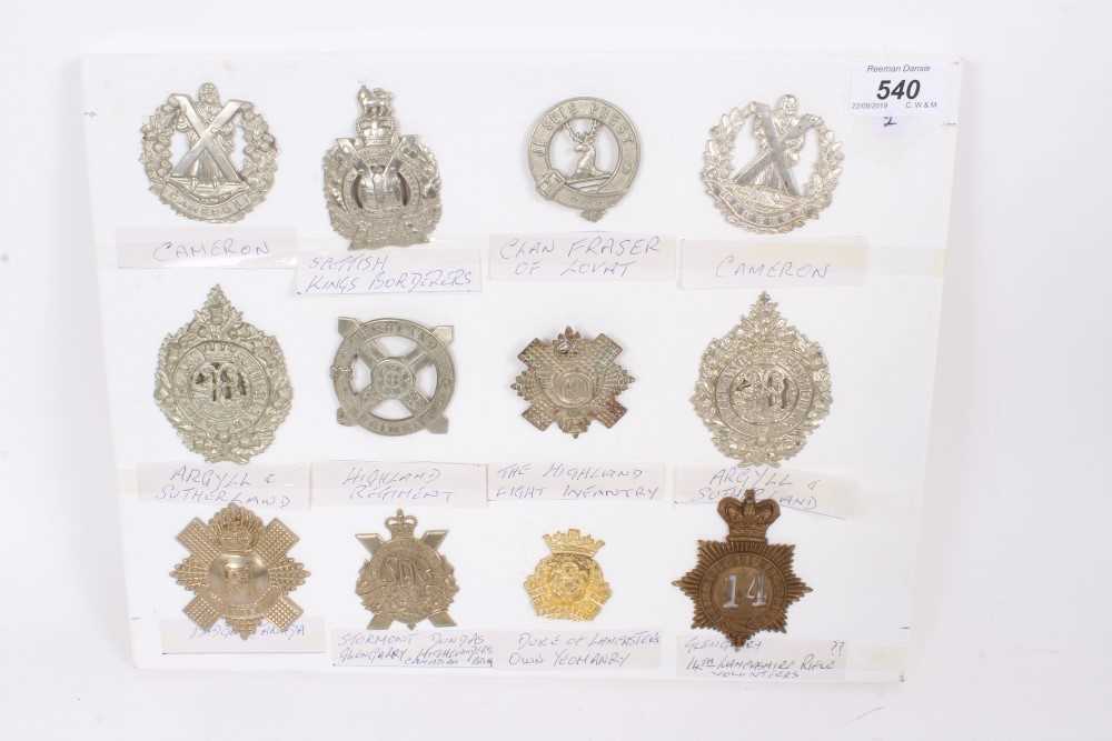 Lot 540 - Group of twelve British military cap badges including Victorian 14th Lancashire Rifle Volunteers Glengarry Badge