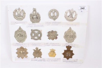 Lot 540 - Group of twelve British military cap badges including Victorian 14th Lancashire Rifle Volunteers Glengarry Badge