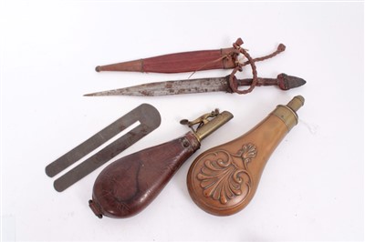 Lot 916 - 19th Century Copper Powder Flask with embossed scroll decoration by G & JW Hawksley, another leather shot flask,an African knife and a button polisher (4)