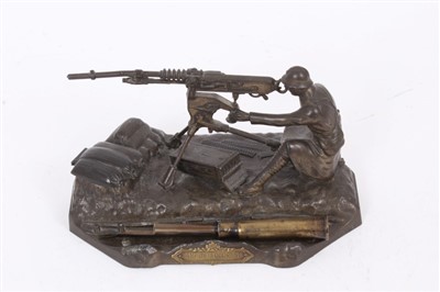 Lot 551 - Unusual French Novelty Diecast inkwell in the form of a machine gunner at his post, with plaque- “Camp de la Courtine” 16cm in length