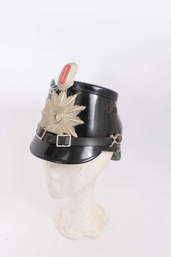 Lot 575 - Post War German Berlin Police Shako, with leather head band by Friedrich Becker & Co. K.G. Berlin