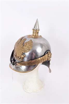 Lot 577 - Reproduction Imperial German Jaeger Regiment Officers' lobster tail helmet of metal construction with gilt eagle badge, gilt and silver plated finish