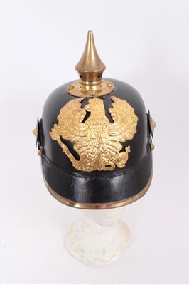 Lot 578 - Reproduction Imperial German Picklehaube helmet of leather construction with gilt eagle badge