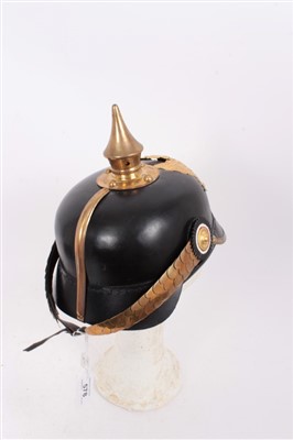 Lot 578 - Reproduction Imperial German Picklehaube helmet of leather construction with gilt eagle badge