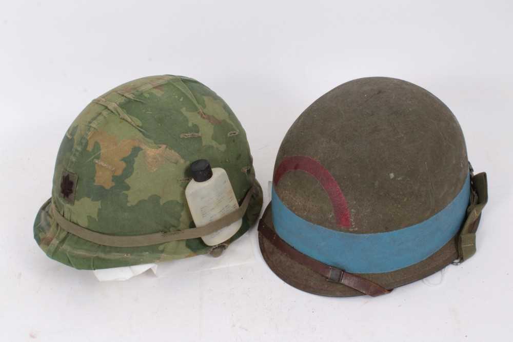 Lot 583 - Film interest- Replica Second World War American M1 Steel helmet, with US Navy marking, believed to be ex. Saving Private Ryan prop, together with an American Paratroopers helmet, believed to be ex...