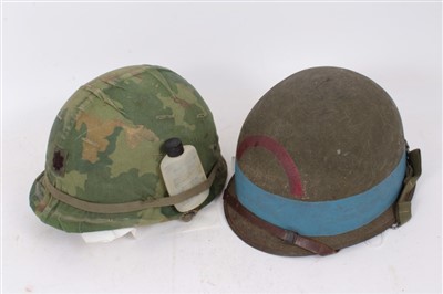 Lot 583 - Film interest- Replica Second World War American M1 Steel helmet, with US Navy marking, believed to be ex. Saving Private Ryan prop, together with an American Paratroopers helmet, believed to be ex...