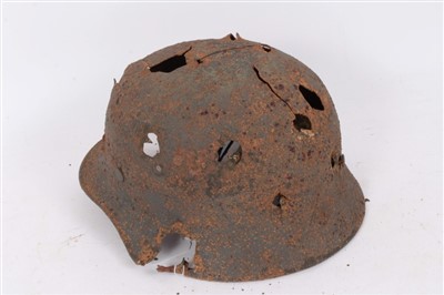 Lot 585 - Second World War Nazi M40 Pattern Steel helmet in ‘relic’ condition, believed to have been recovered from Latvia