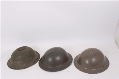 Lot 586 - Second World War British Military MK II Steel helmet, together with a MK II British Military Steel helmet, revised to Dutch issue and another similar revised to Greek issue (3)