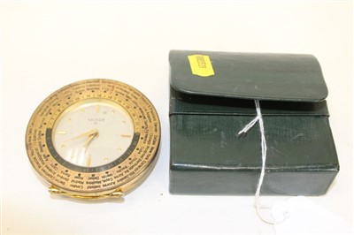Lot 3558 - Luxor eight day travelling alarm clock, with silvered dial gold coloured hands and hour markers, in a brass case with hinged stand and international time scale, together with an outer leather case.