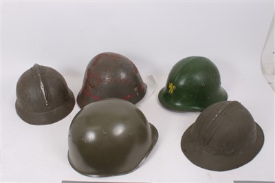 Lot 590 - Group of various military helmets to include Czech steel helmet, French M26 Steel helmet with Polish markings, Belgian M26 steel helmet, Danish M23 helmet and a Bulgarian steel helmet (5)