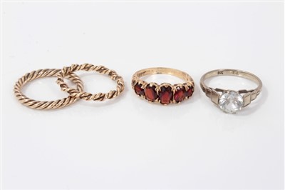 Lot 3270 - Gold (9ct) garnet ring and three other rings (4)