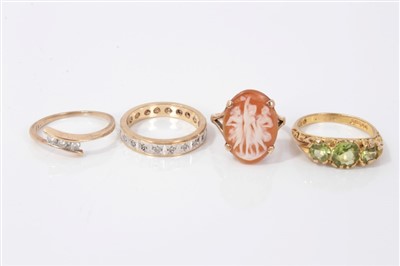 Lot 3295 - Gold (9ct) cameo ring, gold (9ct) diamond three stone ring, gold (9ct) eternity style ring and a gold (9ct) gem set ring (4)