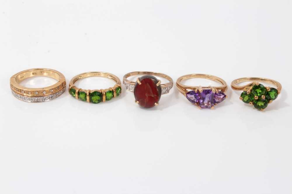 Lot 3296 - Five gold (9ct) gem set dress rings