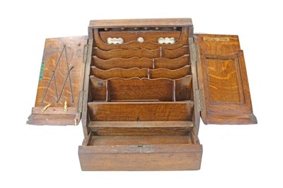 Lot 3614 - Early 20th century oak stationery cabinet with twin opening doors.