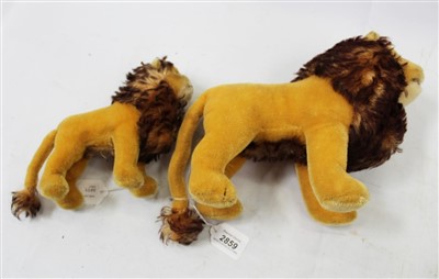 Lot 2859 - Large Steiff male lion( no button), together with a smaller lion (2)