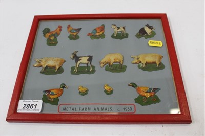 Lot 2861 - Thirteen metal farm animals in frame c.1930’s